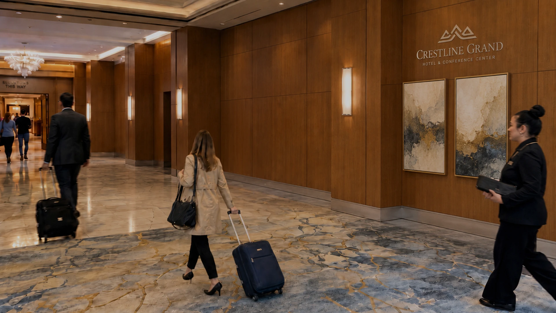 Hotel lobby with wood-paneled walls and marble floor; travelers walk with rolling suitcases near the Crestline Grand sign.